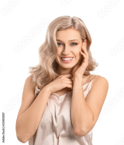 Young blonde with beautiful hair on white background