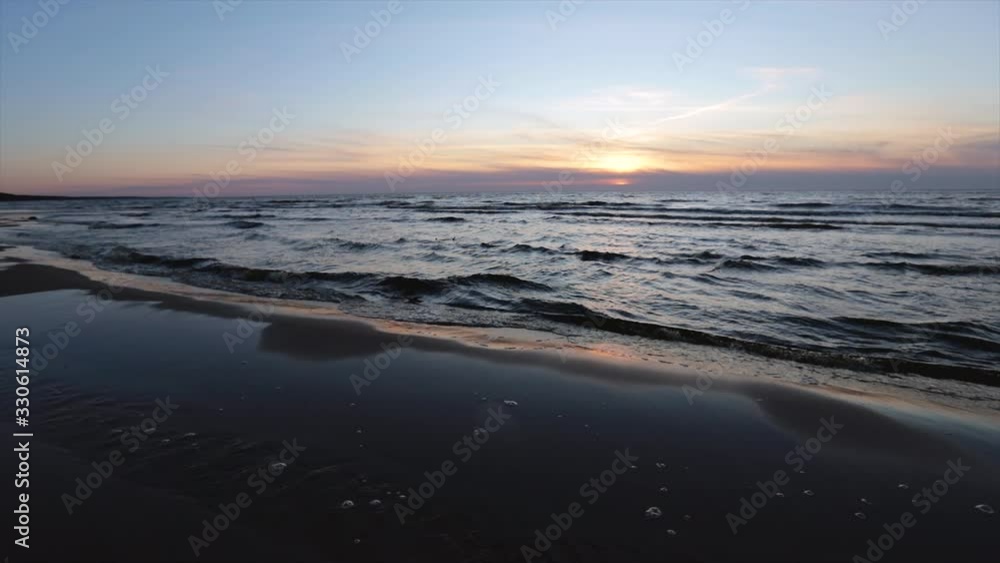 Slow motion walk at sunset sea. Saulkrasti white dune in Latvia Slow motion walk at sunset sea. Saulkrasti white dune in Latvia