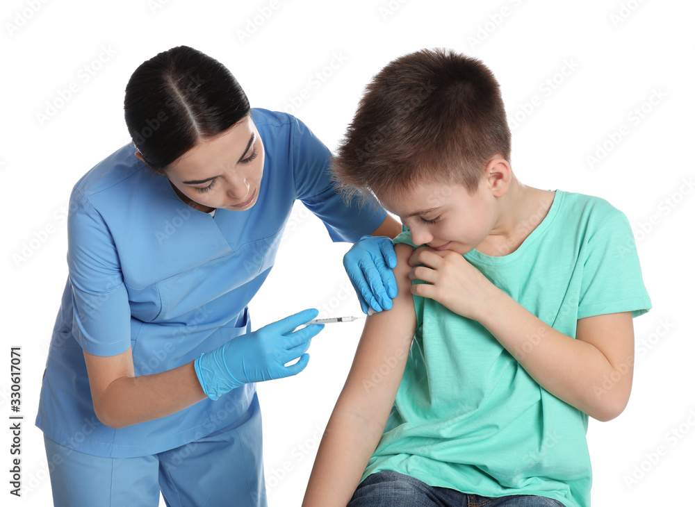 Obraz premium Doctor vaccinating little child on white background