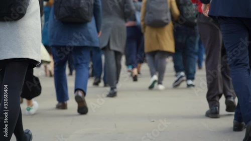 Crowd of pedestrian commuters in London on cool morning in slow motion. Clip 34a photo