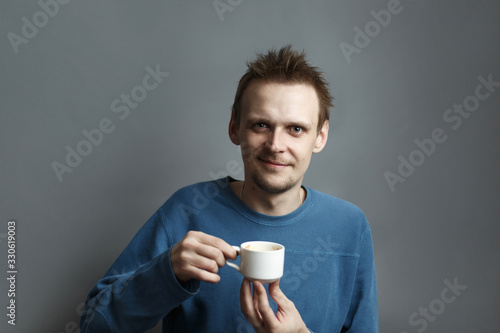 Attractive man hold cup of coffee