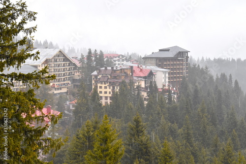 Pamporovo winter resort hotel complexes set among evergreen pine trees in the heart of Rhodope mountain The rounded safe guarded well maintained ski slopes and summits makes it suitable for beginners photo