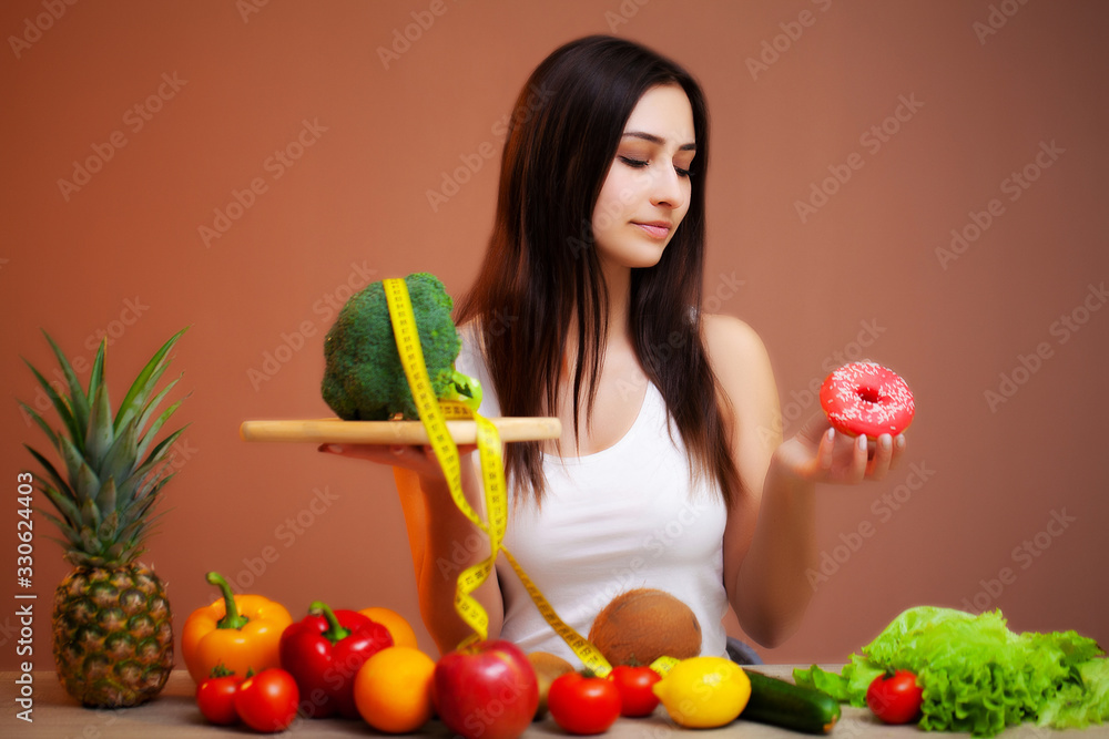 Portrait of a young beautiful girl who supports the diet Portrait of a young beautiful girl who supports the diet