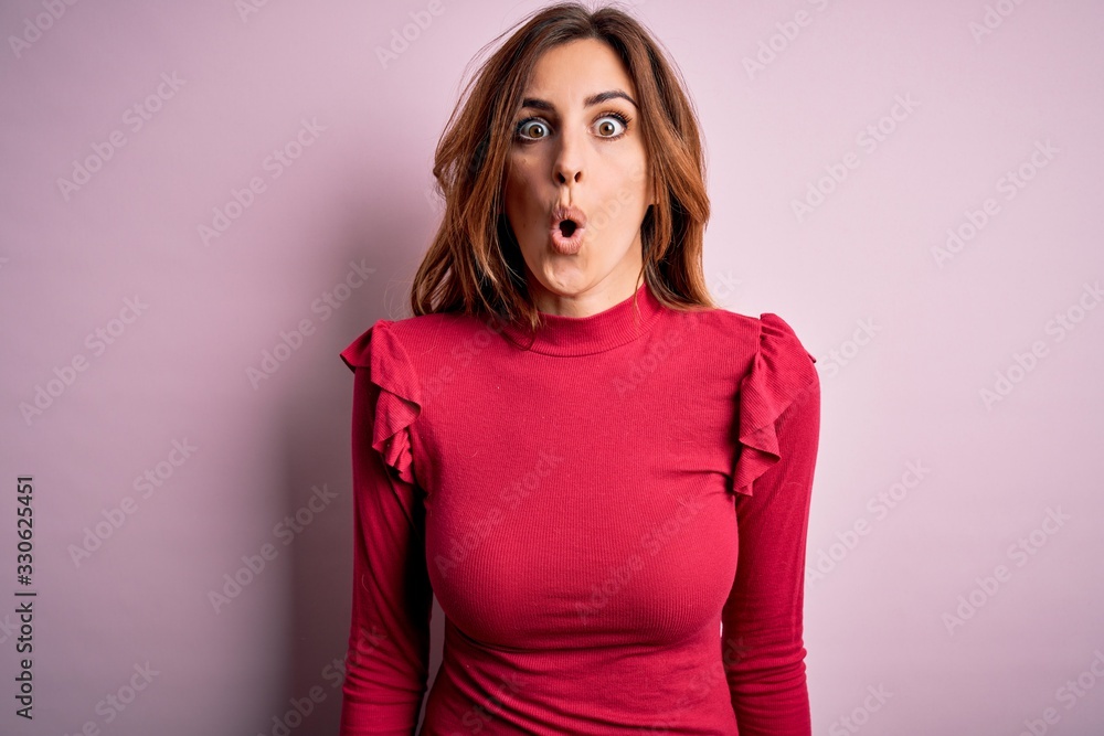 Young beautiful brunette woman wearing casual sweater stnding over pink background afraid and shocked with surprise expression, fear and excited face. Young beautiful brunette woman wearing casual sweater stnding over pink background afraid and shocked with surprise expression, fear and excited face.