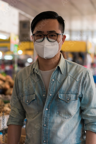 Asian men shopping at the food market photo