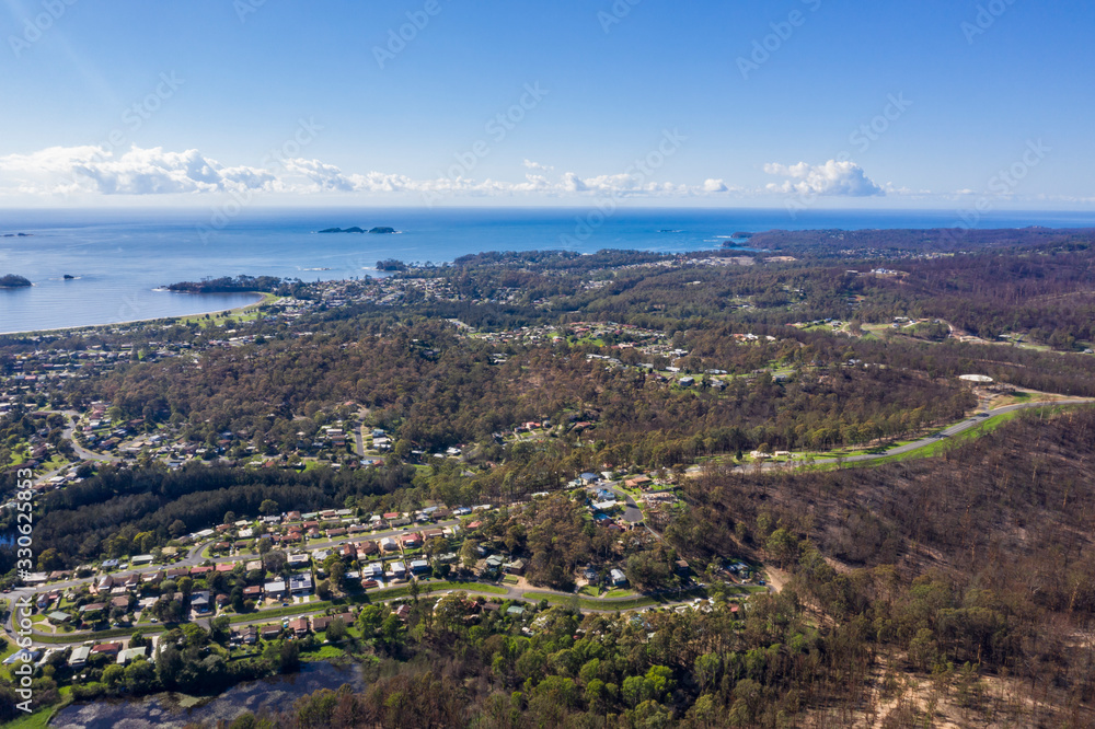 Panoramic aerial drone view of Batemans Bay on the New South Wales South Coast, Australia, looking out to Tasman Sea on a sunny day   