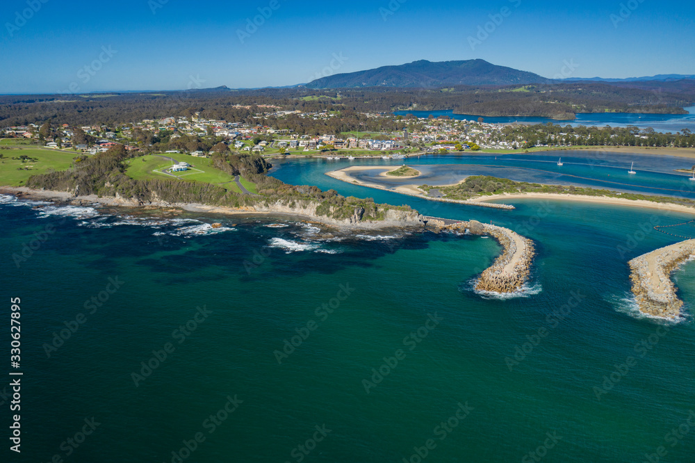 Aerial drone view of Wagonga Head and Wagonga Inlet at Narooma on the New South Wales South Coast, Australia, on a sunny day 