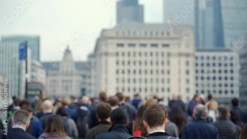 Crowd of pedestrian commuters in London on cool morning in slow motion. Clip 37b