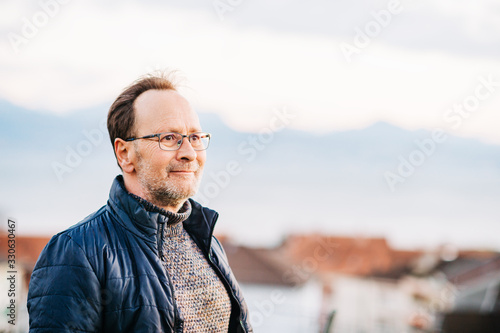 Outdoor portrait of middle age man wearing eyeglasses