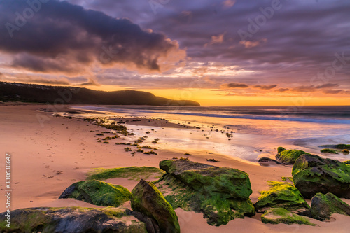 Clouds and Green Mossy Rocks Sunrise Seascape