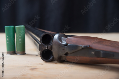 Hunting two-barrel on wooden background