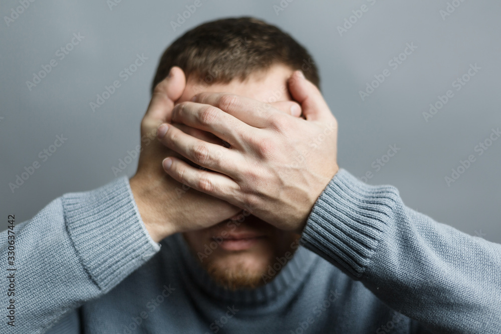 Man closed his eyes with his hands Man closed his eyes with his hands