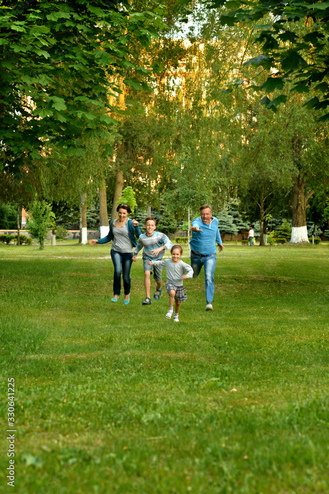 Portrait of happy parents and children running Portrait of happy parents and children running