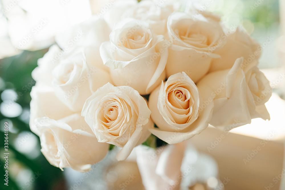 Bouquet close-up in a high key of white pure fresh roses. Bouquet close-up in a high key of white pure fresh roses.