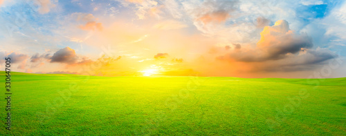 Photography Green grass field and colorful sky clouds at sunset,panoramic view