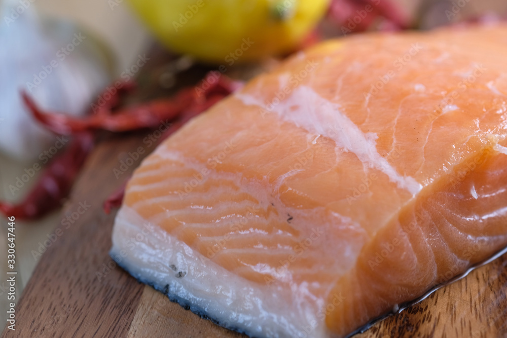 Fresh raw salmon fillets on wooden background. Fresh raw salmon fillets on wooden background.