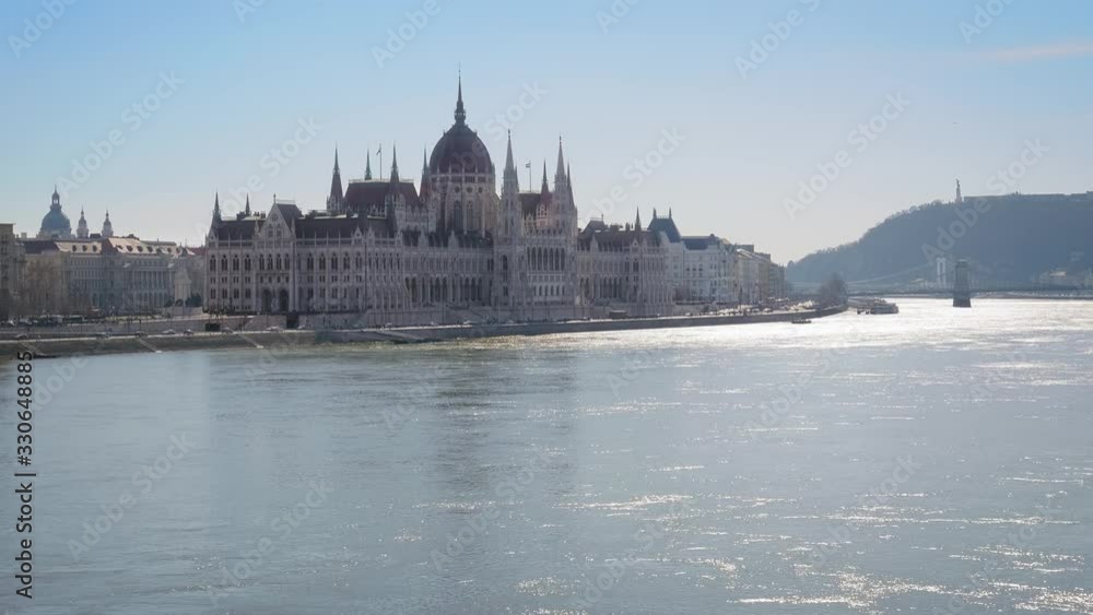 Center of Budapest with Hungarian Parliament and Szechenyi Chain Bridge over the Danube river. Sunny winter day, slow motion Center of Budapest with Hungarian Parliament and Szechenyi Chain Bridge over the Danube river. Sunny winter day, slow motion