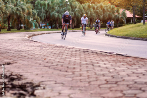 People are cycling on street.