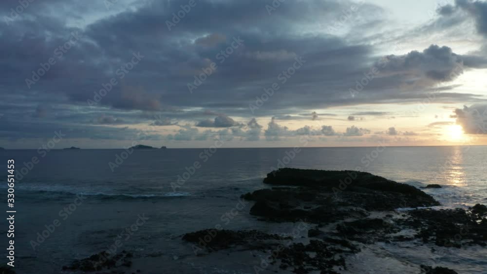 The Ocean Of The South Pacific And Kuata Island In Fiji During Dusk. - aerial shot The Ocean Of The South Pacific And Kuata Island In Fiji During Dusk. - aerial shot