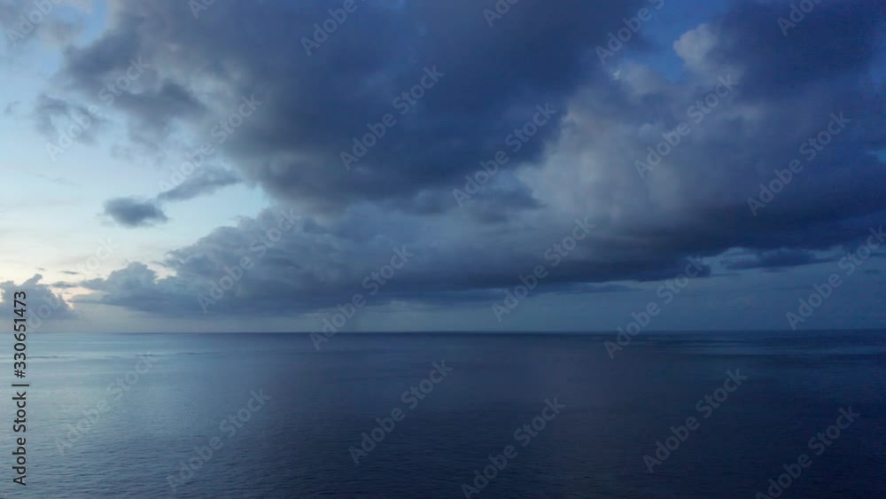 The Heavy Blue Clouds And The Peaceful And Relaxing Island Beach In Fiji At Sunset - Aerial Drone Shot The Heavy Blue Clouds And The Peaceful And Relaxing Island Beach In Fiji At Sunset - Aerial Drone Shot