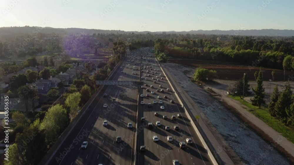 Following cars directly above the San Fernando Valley freeway during rush hour Following cars directly above the San Fernando Valley freeway during rush hour