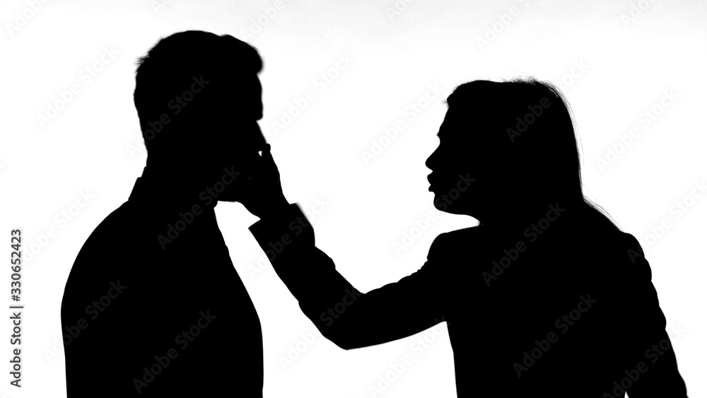 The Silhouette of Woman Slapping Partner While Fighting