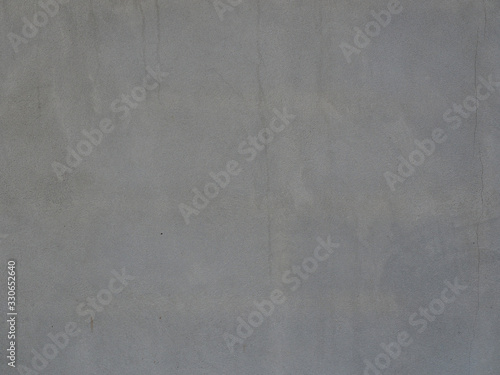 Gray cement wall with scratches and stains for background.Have copy space for text.