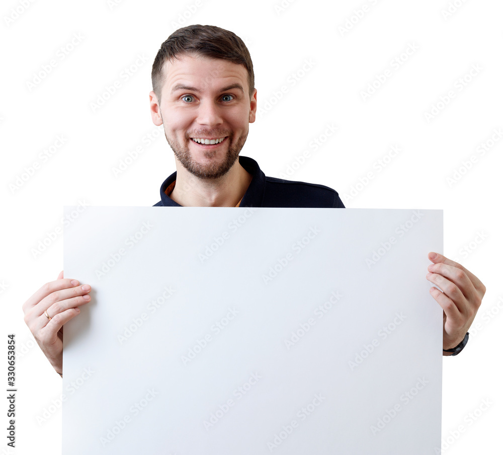 Smiling businessman holds a blank white sheet for text space. Smiling businessman holds a blank white sheet for text space.