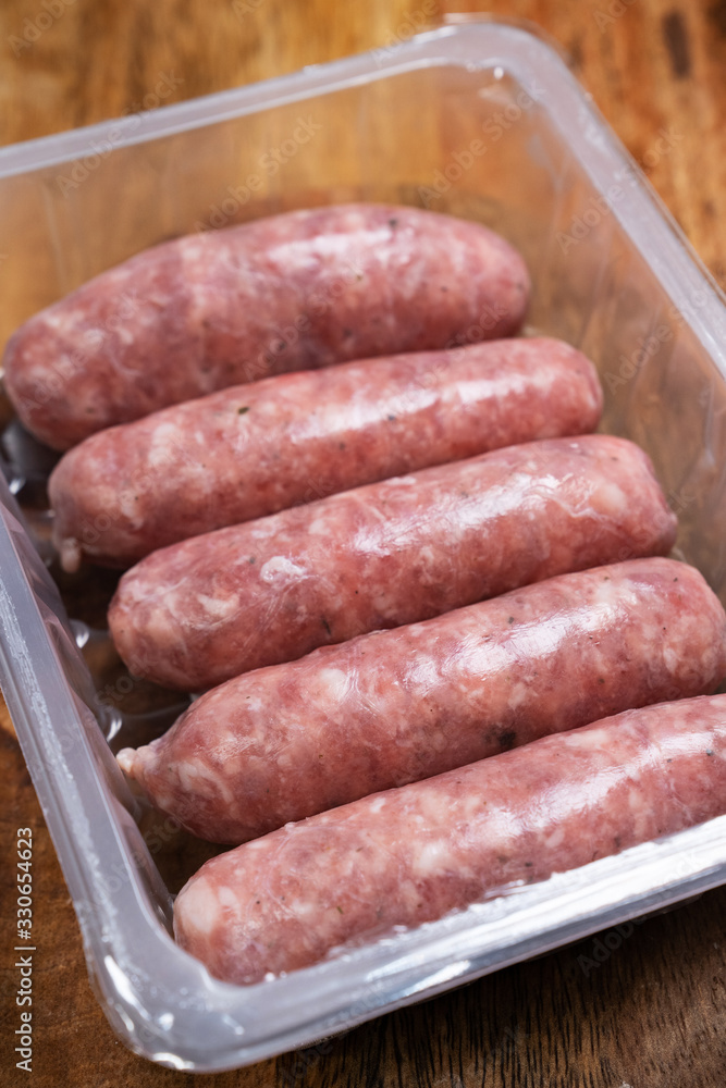raw sausages in transparent packaging. raw sausages in transparent packaging.