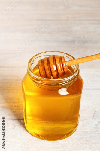 Jar of Honey with Honey Dipper photo