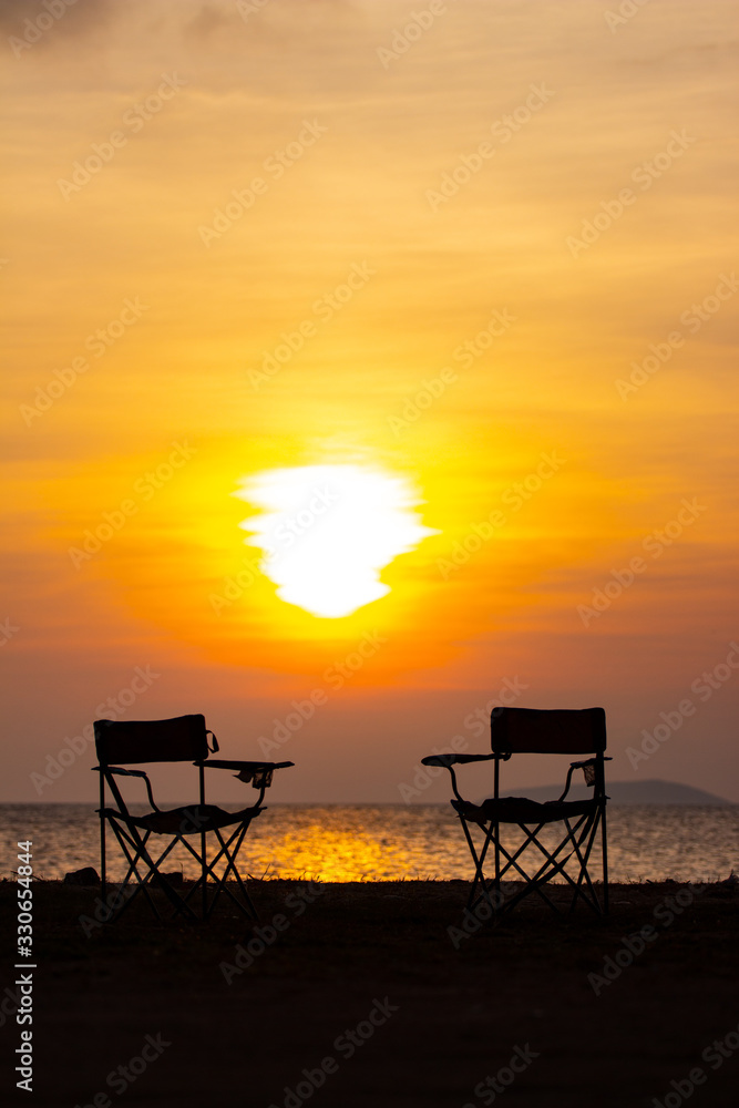 two chairs beach sunset clouds two chairs beach sunset clouds