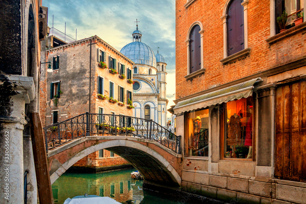 Venice cityscape, water canal, bridge and traditional buildings of Venice, Italy. Beautiful ancient historical buildings of Venice, Italy. Architecture and landmarks of Venice and Italy
