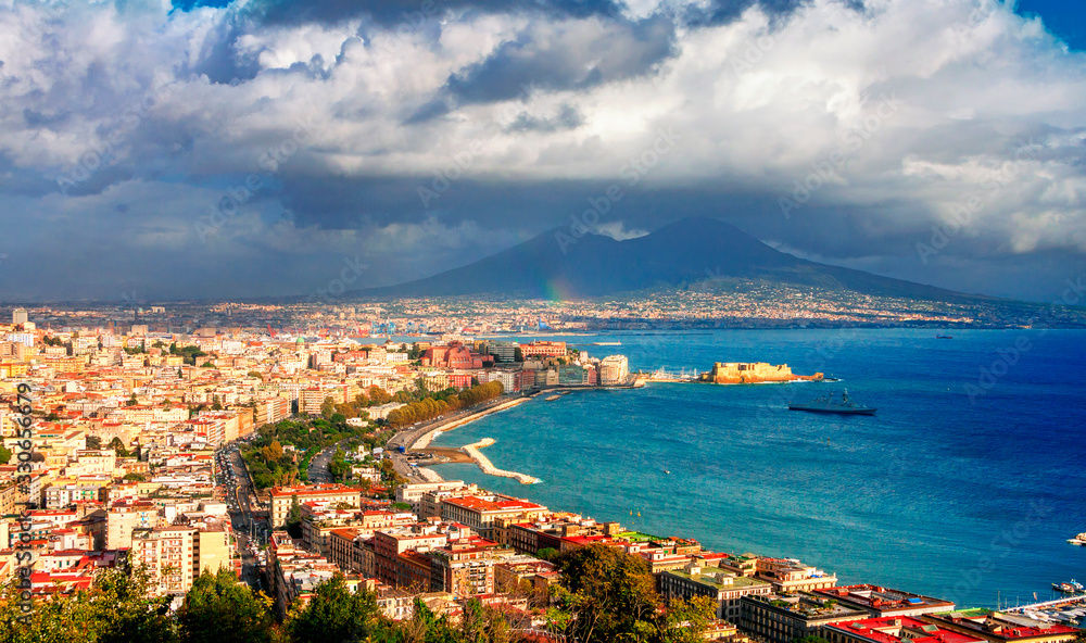 Panoramic scenic view of Naples after rain, Campania, Italy. Part of the rainbow is visible.