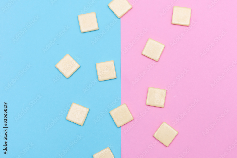 Blue and pink background with scattered blank word tile blocks for concept of growth, goal setting, progress and achievement in business or education. Blue and pink background with scattered blank word tile blocks for concept of growth, goal setting, progress and achievement in business or education.