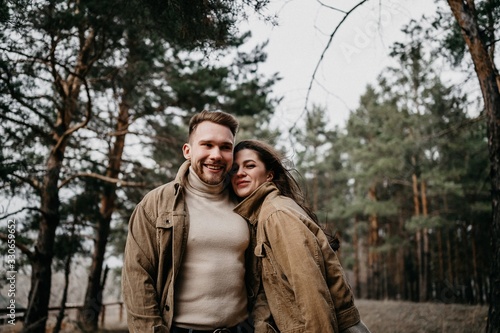 Love story of Oleg and Anastasia. Stylish photo shoot in the forest in cloudy weather. photo