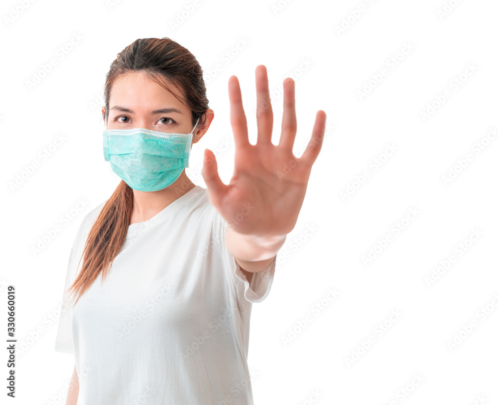 Asian woman wearing medical protective face mask for protect infection the virus and show hand stop gesture isolate on white background, With clipping path, Global healthcare and infection concept. Asian woman wearing medical protective face mask for protect infection the virus and show hand stop gesture isolate on white background, With clipping path, Global healthcare and infection concept.