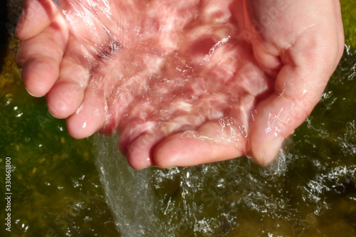 Canvas Print natural spring water in the hands
