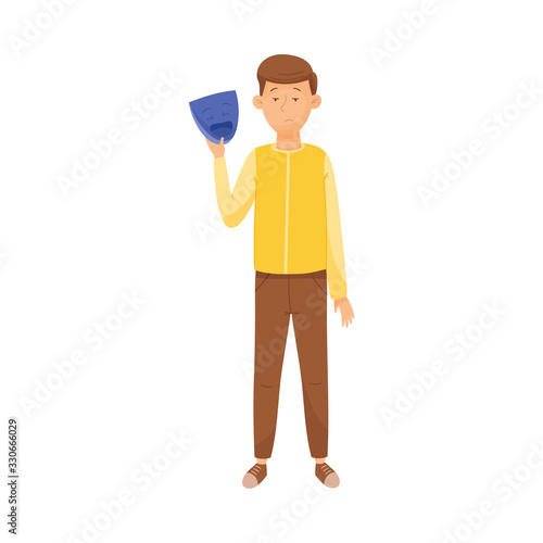 Young Sad Man Standing and Holding Mask with Happy Emotion in His Hands Vector Illustration