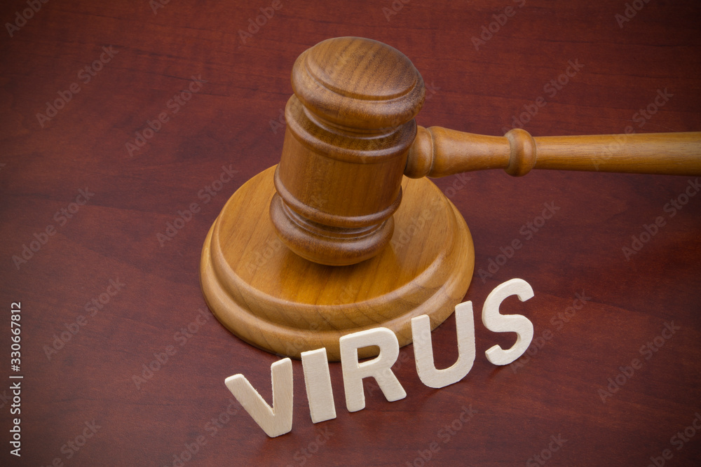 Judge gavel with word virus close up. Concept of quarantine and law against virus covid-19. Judge gavel with word virus close up. Concept of quarantine and law against virus covid-19.