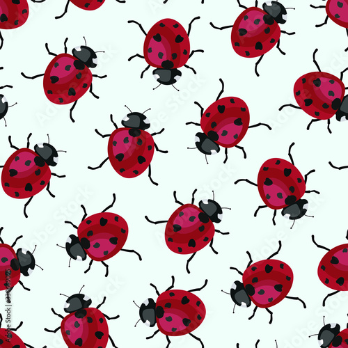Vector seamless pattern with ladybugs on light blue background; cute design for fabric, wallpaper, wrapping paper, textile, web design.