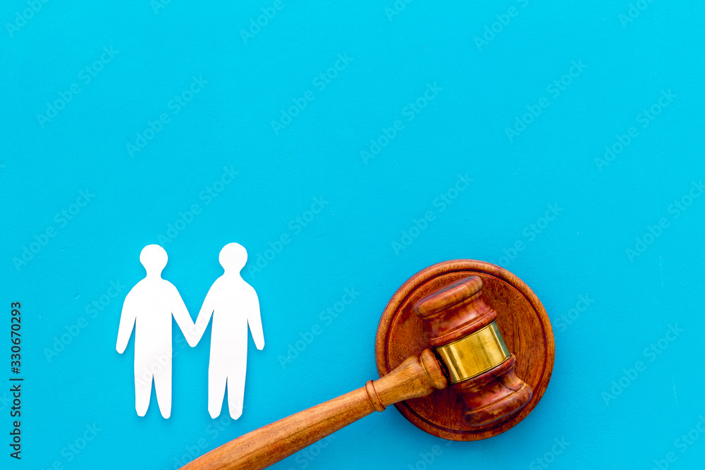 LGBT divorce. Judge gavel, male couple on blue background top-down copy space LGBT divorce. Judge gavel, male couple on blue background top-down copy space