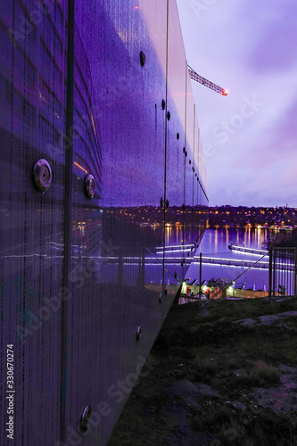 Stockholm, Sweden A view between buildings at night from Liljeholmskajen towards Sodermalm. photo