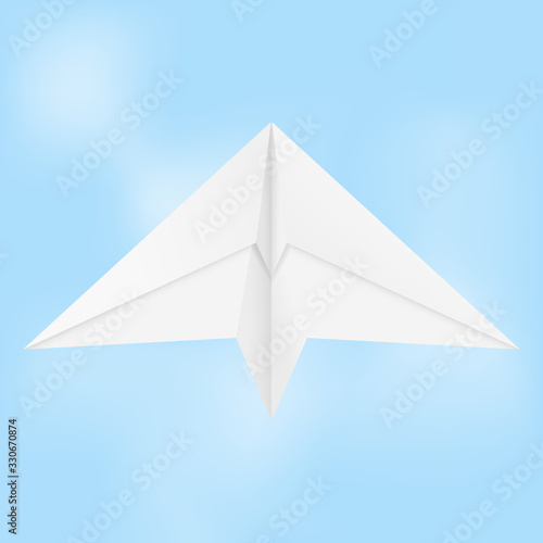 Paper airplane. Folded glider in blue sky