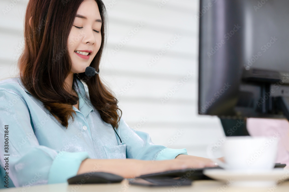 Call center office. Beautiful woman using computer and headset for consulting clients online. Call center office. Beautiful woman using computer and headset for consulting clients online.