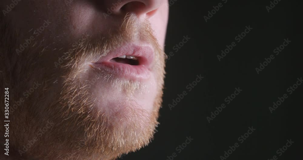 Breathing man mouth close-up slow motion, studio shot in 4K prores HQ Breathing man mouth close-up slow motion, studio shot in 4K prores HQ