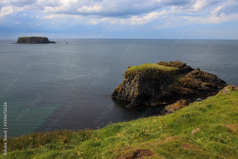 Ballintoy (Ireland), - July 25, 2016: Coastal scenery near Carrick a Rede along the causeway coast, Co. Antrim, Ireland