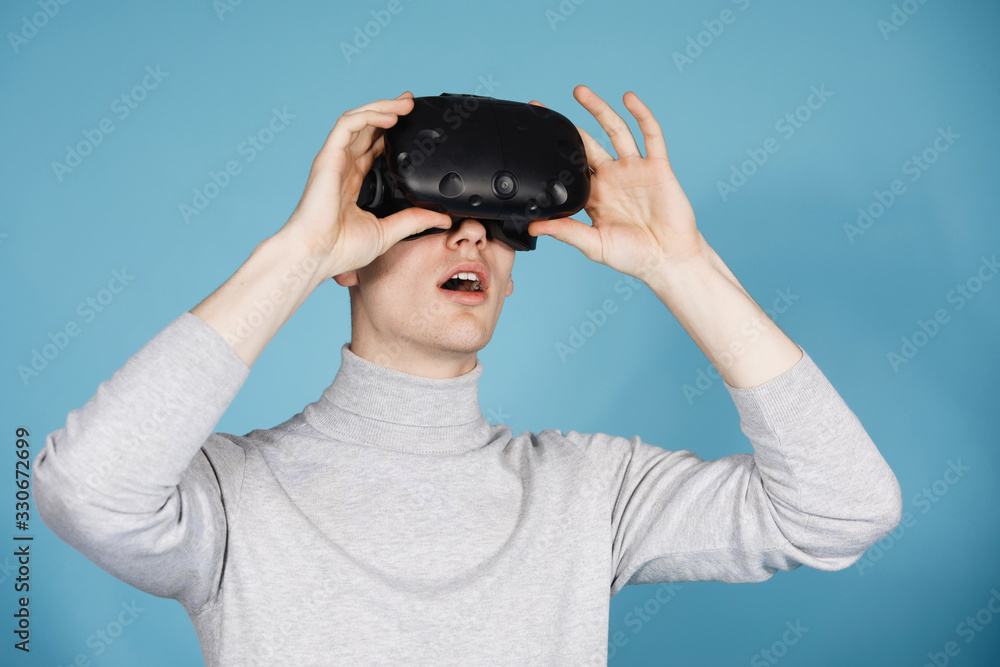 Guy plays with virtual reality glasses Guy plays with virtual reality glasses