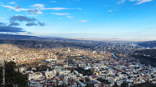 TBILISI, GEORGIA DECEMBER 14, 2019: Beautiful aerial view of the central part of city and blue sky in Tbilisi, Georgia