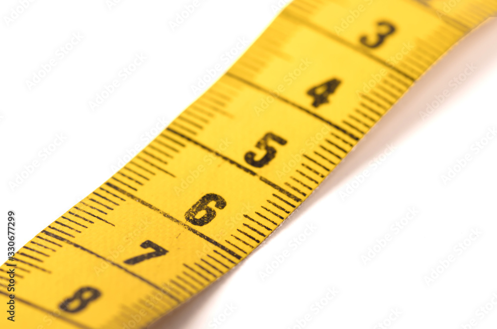 Close-up of a yellow measuring tape isolated on white - 6 Close-up of a yellow measuring tape isolated on white - 6