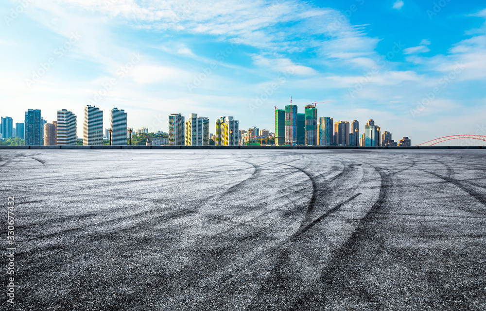 Chongqing empty asphalt road and city skyline in summer Chongqing empty asphalt road and city skyline in summer